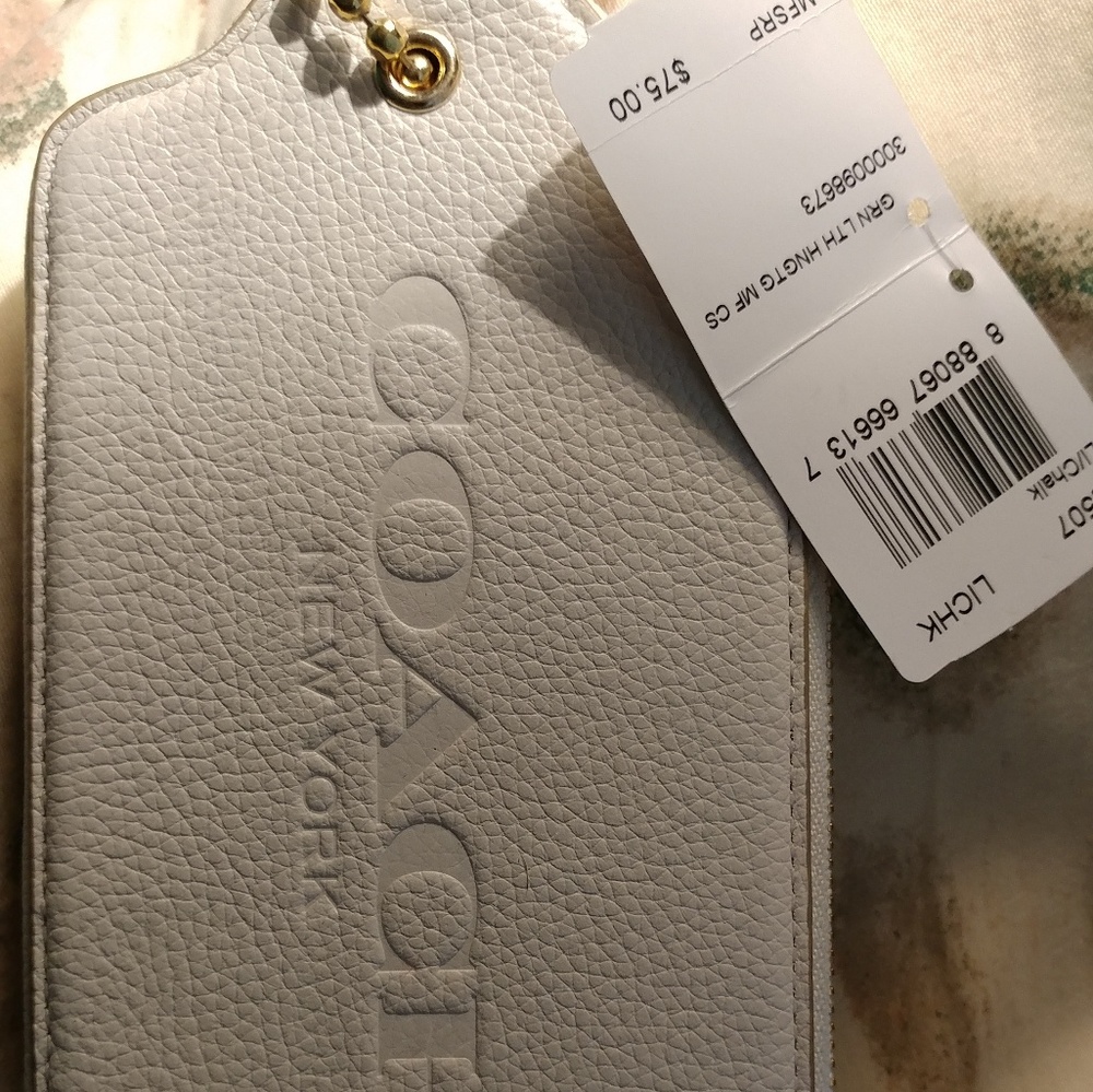 New with tag Fob shaped white wallet
